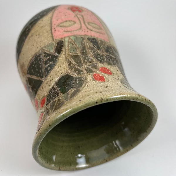 Ceramic vase with geometric pattern on a white background
