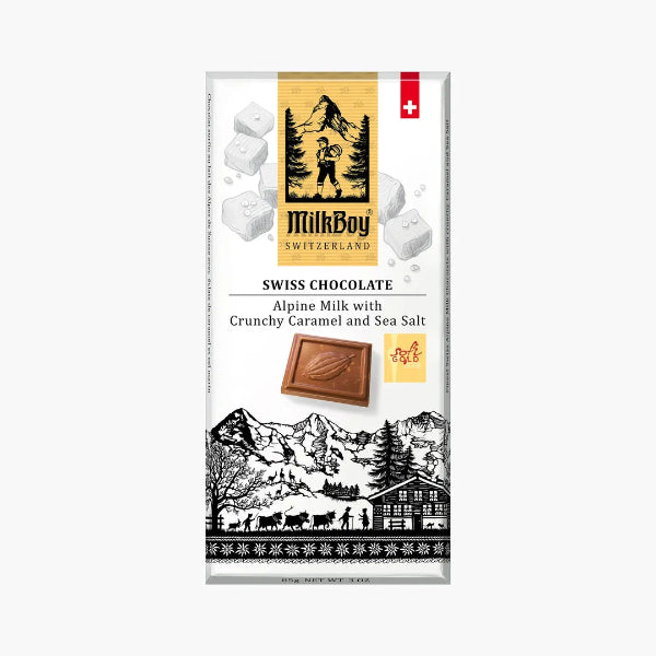 MilkBoy Swiss chocolate packaging with mountain and cabin design on a white background