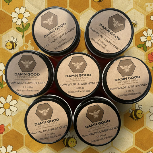 Multiple jars of 'Damn Good' raw wildflower honey 
