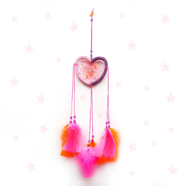 Heart-shaped dreamcatcher with pink and orange feathers on a white background