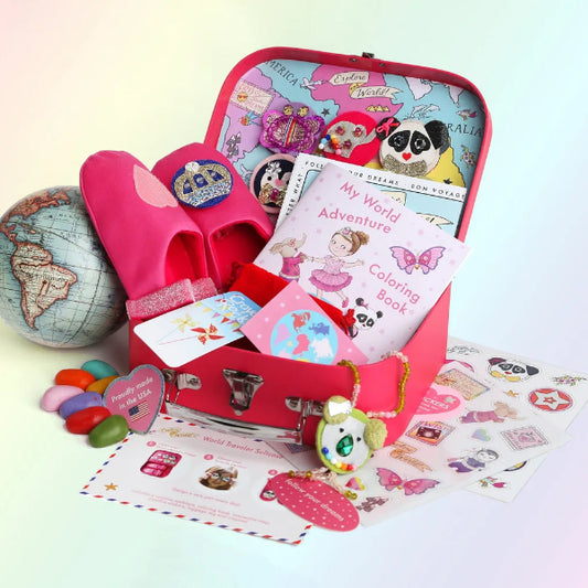 Children's travel kit with pink shoes, coloring book, and toys on a light pink background