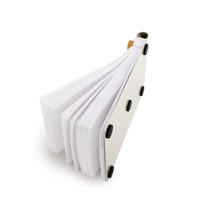 a stack of white papers bound to a brass notebook