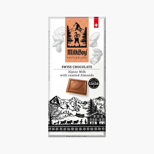 MilkBoy Swiss Chocolate packaging with mountain and cabin design on a white background